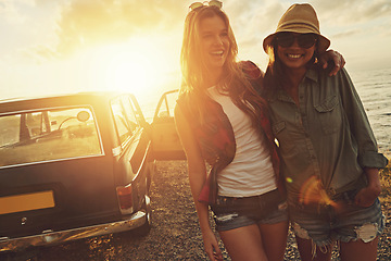 Image showing Friends, travel and smile for sunset road trip adventure, journey or vacation by the ocean. Portrait of woman and best friend smiling for traveling, freedom or holiday with lens flare by the beach