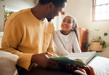 Image showing Father, child and book for story time on bed with smile enjoying reading or listening and bonding together at home. Happy dad and daughter sitting with textbook for learning or education in bedroom