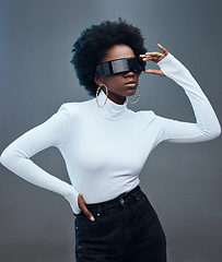 Image showing Futuristic sunglasses, fashion and black woman, cyberpunk and gen z with trendy designer brand against studio background. Young model, stylish and natural curly hair with beauty and edgy style
