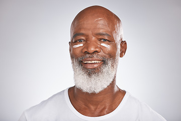 Image showing Facial cream, beauty and skincare of senior man in studio for self care with dermatology and cosmetics product on skin. Portrait of happy black male with sunscreen or lotion for glow and moisturizer