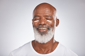 Image showing Beauty, facial cream and skincare of black man in studio for dermatology, cosmetics and self care on grey. Face of happy senior male with sunscreen or lotion on skin for glow, health and wellness