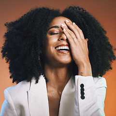 Image showing Happy black woman, face and hand with hair and beauty, manicure and hair care with afro against studio background. Funny, pride and cosmetic skincare, facial and natural curly hair texture with laugh