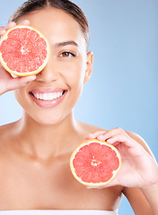 Image showing Beauty, grapefruit and woman with face and natural cosmetic care, facial and glow with vegan product against studio background. Skincare, healthy skin and wellness with fruit, hands and cosmetics.