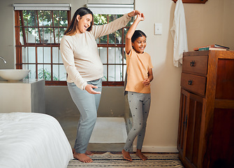 Image showing Pregnant mother, child and happy family dancing in home bedroom for bonding, love and care for girl. Smile of kid and woman together in house for pregnancy celebration with happiness and support