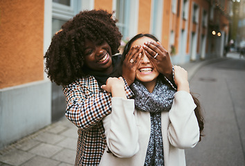 Image showing Women, bonding or hands covering eyes in hide and seek, playful or comic game in New York City, road or street. Smile, happy or fun friends and surprise hand gesture in travel freedom or wow birthday