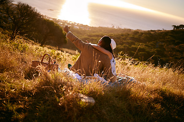 Image showing Selfie, sunset and couple on a picnic in the mountains for a date, anniversary or bonding in Costa Rica. Nature, phone photo and man and woman in a field for a honeymoon and mobile communication