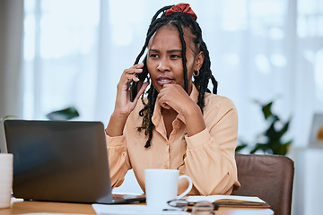 Image showing African woman, laptop and smartphone call conversation for online communication or planning strategy in home office. Black woman, focus and talking on phone call for business planner with tech device