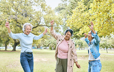 Image showing Senior women, dancing or music headphones in silent disco, retirement fun or energy movement in bonding wellness. Smile, happy friends or elderly dancers listening to radio audio in nature trees park