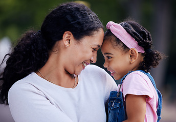 Image showing Mother, daughter and hug in a park, love and sweet while bonding outdoor together. Black woman, girl and touching face in a garden for fun, precious and happy, laugh and relax in moment of motherhood