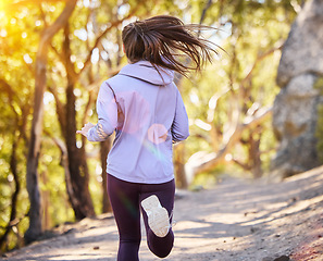 Image showing Back, woman and running in nature, training and fitness for wellness, balance and healthy lifestyle. Female athlete, lady and runner in forest, practice or exercise for stress relief or summer break