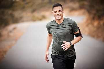 Image showing Running, fitness and man in road portrait for exercise, training and workout with lose weight, muscle and energy. Happy runner, athlete or healthy person jogging for sports challenge in nature street