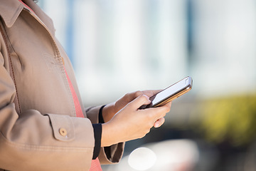 Image showing Hands, search or business woman on phone for networking, social media or communication in London street. Travel, invest or manager on smartphone for research, internet or blog content review outdoor