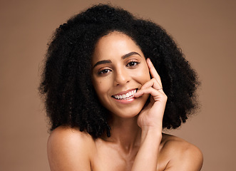 Image showing Black woman, studio portrait and smile with beauty, makeup and cosmetic wellness with hands, face or natural hair. Model, soft skin and facial cosmetics, self care and afro by brown studio background