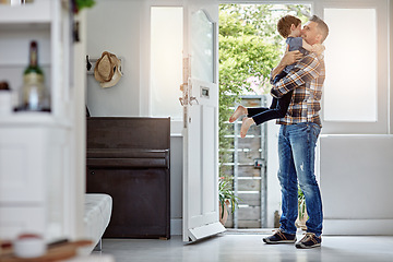 Image showing Happy family, love and father hug son, happy and excited to return home, hello and bond. Happy family, greeting and child embrace parent at front door, coming home and content, happiness and playful