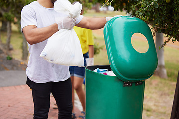 Image showing Volunteer cleaning, trash bin and man throw garbage, pollution or waste product for environment support. Community help, NGO charity and eco friendly people helping with nature park plastic clean up