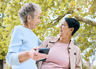 Image showing Senior women, laughing or phone meme in nature park, garden or relax environment in retirement, support or trust. Smile, happy friends or elderly bonding with comic, crazy or funny joke on technology