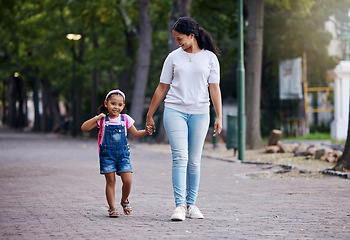 Image showing Walking, park and mother holding hands with girl on journey for back to school, learning and class for first day. Love, black family and mom with child walk to kindergarten for education development