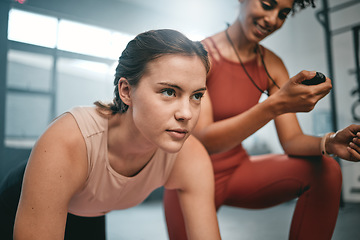 Image showing Fitness, gym client and personal trainer with time of health exercise, performance workout or core muscle building. Timer, sport commitment or wellness coach training, coaching and timing floor plank