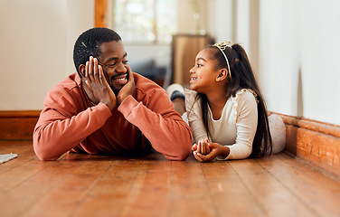 Image showing Father, love and daughter relax on the floor, happy and bonding while talking in their home together. Black family, girl and parent enjoy conversation while lying, content and sweet on the weekend