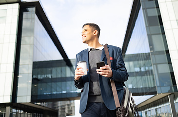 Image showing Businessman outside building with phone, coffee and bag, happy waiting for online taxi service after work. Office, business and success, man with smile holding 5g smartphone standing on city street.