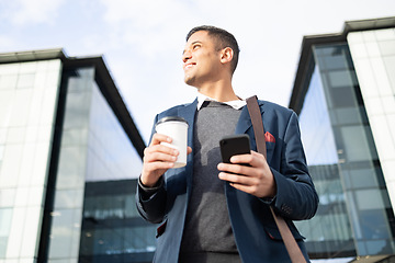 Image showing Businessman at office building with phone, coffee and bag, happy waiting for online taxi service after work. City, business and success, man with smile and 5g smartphone standing outside workplace.