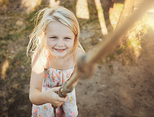 Image showing Child, portrait or playing rope in park, nature garden or house backyard on holiday, vacation or summer break. Jungle gym exercise or fun game for smile, happy kid or girl top view in energy climbing