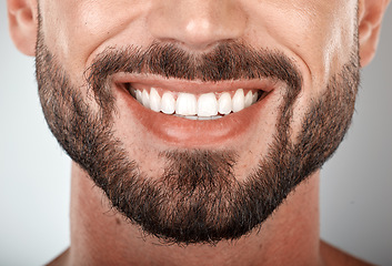 Image showing Smile, mouth and teeth whitening of man on studio background of wellness. Closeup male model face with clean dental, fresh breath and happy tooth implant, aesthetic beauty or healthy cosmetic results