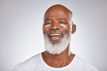 Image showing Black man, skincare and facial cream on healthy skin in studio for self care with dermatology and cosmetics product. Face portrait of happy senior male with lotion for glow, health and wellness