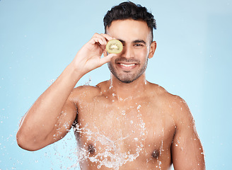 Image showing Skincare, beauty and water splash, man with fruit for vitamin c facial detox for healthcare, natural healthy skin and smile. Water, wellness and sustainability, organic luxurycleaning and grooming.