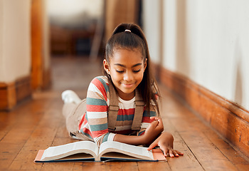 Image showing Knowledge, black girl and reading on the floor, smile or hobby for learning, creative or relax on weekend. Young lady, African American female on ground or book for story time, literature or chilling