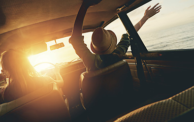 Image showing Friends, women and sunset road trip at beach with car, hands and window in air for freedom, celebration or sea. Summer sunshine, vacation and ocean for driving, travel or nature by waves on adventure