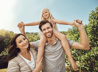 Image showing Portrait, mother and father giving his child a piggyback in a green garden for quality time together. Nature, love and happy family having fun and bonding in a park for adventure, holiday or vacation