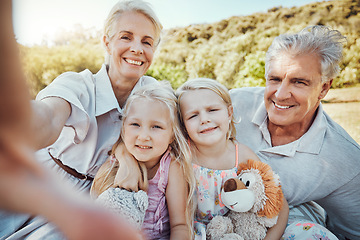 Image showing Love, selfie and grandparents with girls in park, smile or loving together for vacation, break or bonding. Portrait, granny or grandfather with granddaughters outdoor, playful or happiness on holiday