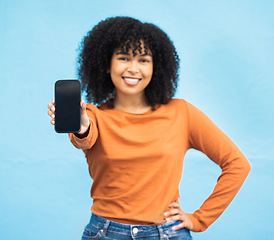 Image showing Black woman, hand or portrait of phone screen mockup on isolated blue background in social media app or web design. Smile, happy person or student on technology mock up, city contact or communication