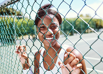 Image showing Fitness, fence or portrait of black woman on a tennis court relaxing on training, exercise or workout break in summer. Happy, sports athlete or healthy African girl ready to play a fun match or game