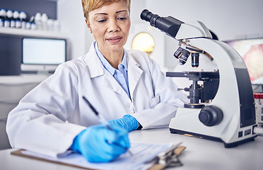 Image showing Senior black woman, research or scientist writing a science report in a laboratory for medical data analysis. Healthcare, focus or doctor working on chemistry paperwork, documents or development