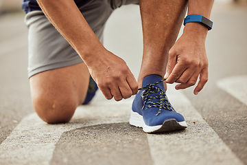 Image showing Sports, fitness or hands tie shoes to start training, cardio workout or exercise in city road. Legs, man or healthy athlete runner with running shoes or footwear laces ready for body goals or race