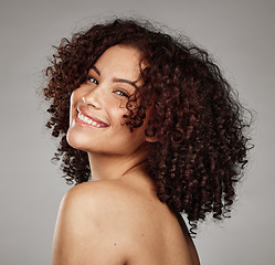 Image showing Portrait, face and beauty with a model black woman in studio on a gray background for skincare treatment. Facial, wellness and natural with an attractive young female posing to promote a skin product