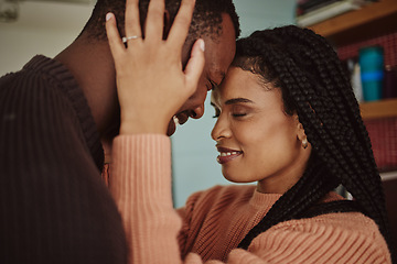 Image showing Black couple, love and care while together for happiness in a happy marriage with commitment and care. Young man and woman touching face of head while in a house to bond, intimate and show commitment