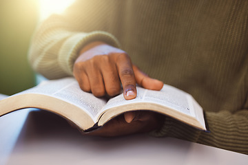 Image showing Student, finger and reading book in university library, college campus or school classroom for education, learning or studying. Zoom, man and hand on research textbook for scholarship degree thesis