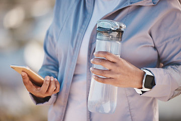 Image showing Fitness, water and phone with hands of woman in mountain for jogging, workout or cardio training. Social media, progress tracker and running app with runner on path checking mobile for endurance goal