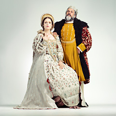 Image showing Fashion, medieval and king with queen on a white background for power, leaders and ruler. History, theatre and royal couple portrait in vintage, renaissance and Victorian cosplay isolated in studio