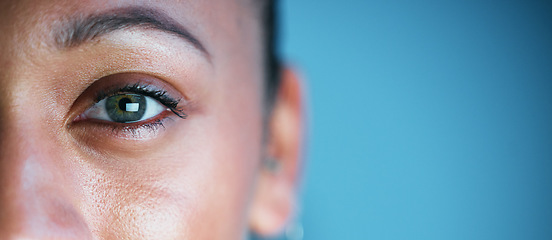 Image showing Eye, face and mockup with woman in portrait, vision and eye care with ophthalmology isolated on blue background. Eyebrow, future and perception, contact lens and lashes, awareness and focus in studio