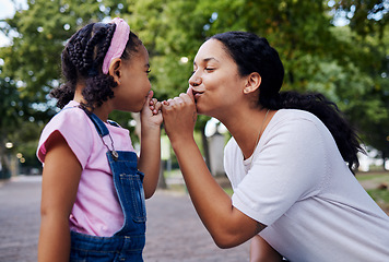 Image showing Mom, child and fun playing park together with hands to mouth in cute kiss gesture on garden path. Love, happiness and mother and small girl have bonding time with outdoor games and happy development.