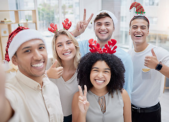 Image showing Christmas party, selfie and business people with hand gesture taking pictures. Xmas portrait, employee or group of friends taking social media photo with thumbs up or peace sign at office celebration