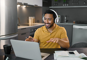 Image showing Happy man, headphones and webinar or music on laptop in home office while talking online. Entrepreneur person at desk with virtual communication for freelance work with video conference for learning