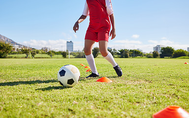 Image showing Soccer child, field and training for fitness, sports and balance for control, speed and strong body development. Cropped football player kid, fast dribbling and exercise feet on grass in Cape Town