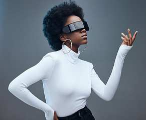 Image showing Fashion, futuristic and black woman with sunglasses, cyberpunk and against a studio background. African American female, lady and gen z youth with beauty, designer glasses and marketing with vision