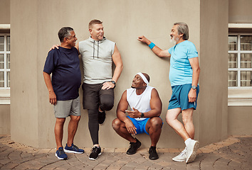 Image showing Happy men, fitness break and group exercise on wall background in urban city. Smile, sports training and male friends talking about workout, wellness support and team diversity of healthy lifestyle