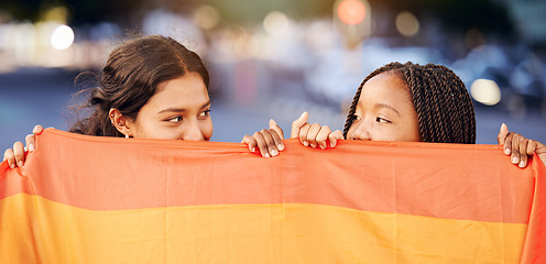 Image showing Rainbow flag, LGBTQ and happy lesbian couple with love at a freedom, pride or community parade in the city. Celebration, interracial and gay women with commitment at a LGBT sexuality event in town.